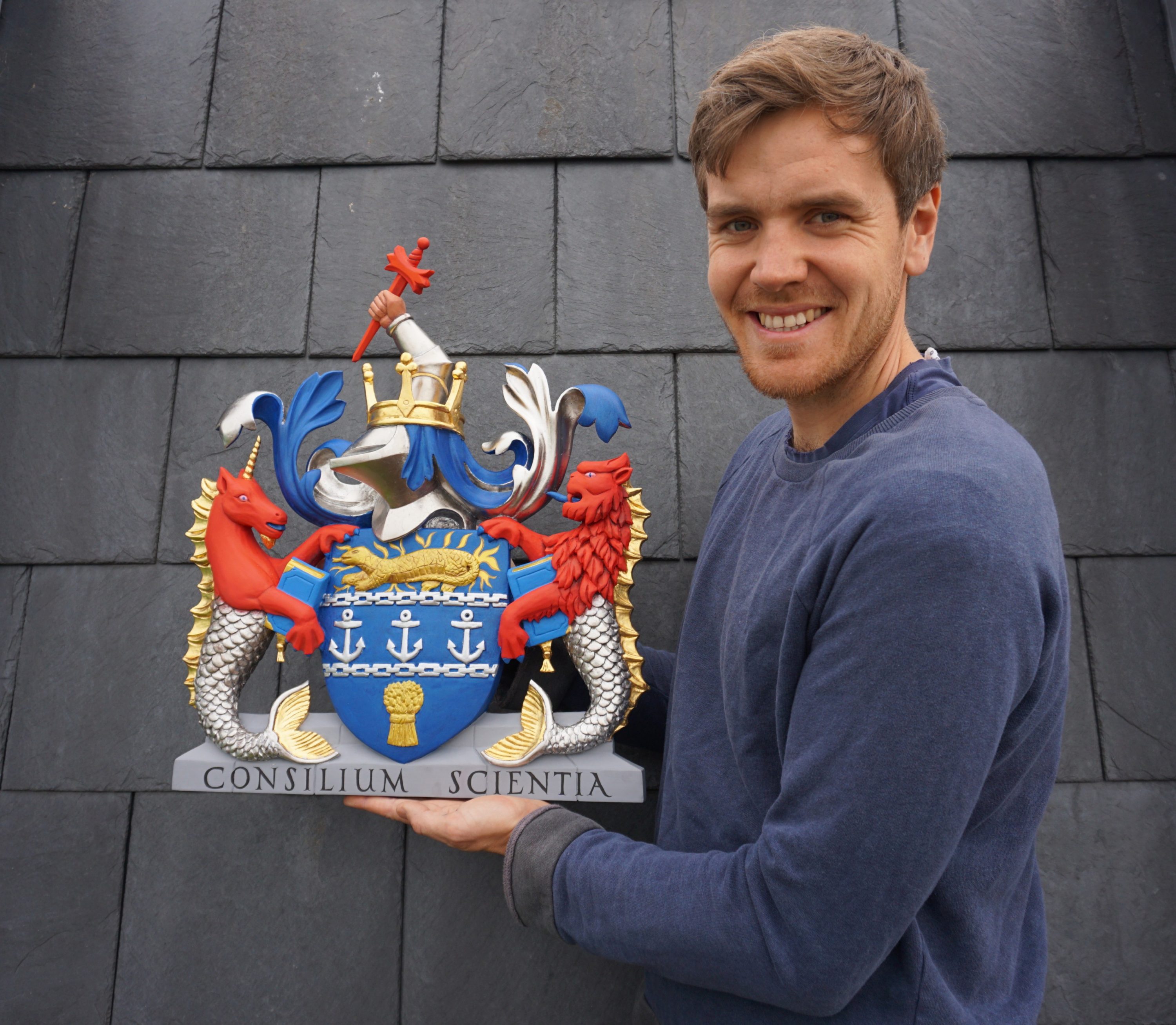 William Barsley holding the coat of arms